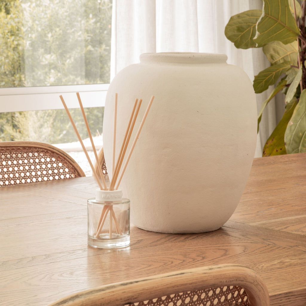 IT04181 Naturals Diffuser 120ML Coconut & Passion Berry - diffuser pictured sitting on a table inside a home setting