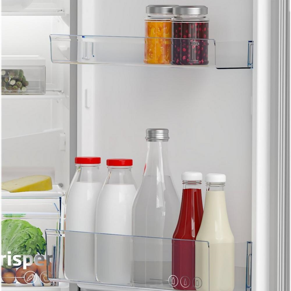 Beko CCFM4582S 55cm 50/50 Frost Free Fridge Freezer - close-up view of appliance door with various bottles and containers arrayed on two door balconies