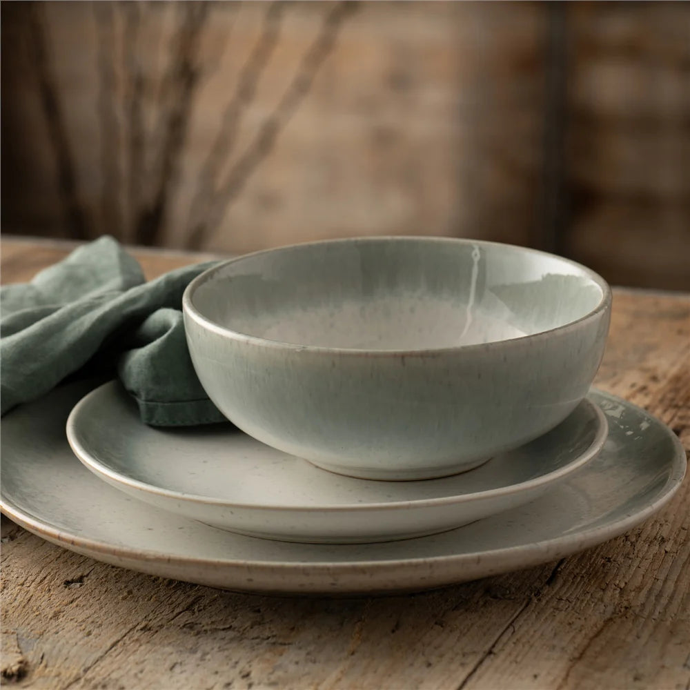 Belleek 7169 Tivoli 12 piece set - a bowl on top of a small plate on top of a larger plate, set on a wooden table