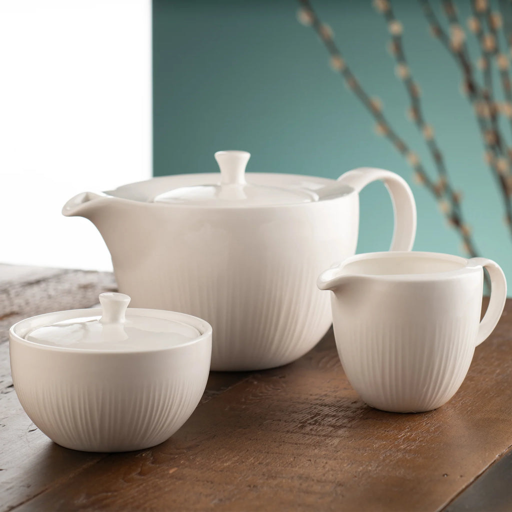 Belleek 9307 Erne Teaset - Teapot, Cream and Sugar - Erne tea set placed on top of a wooden table