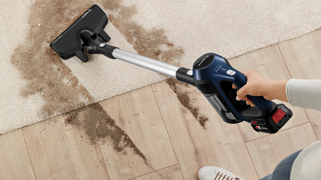 Woman cleaning with Bosch BBS611GB Cordless Vacuum Cleaner