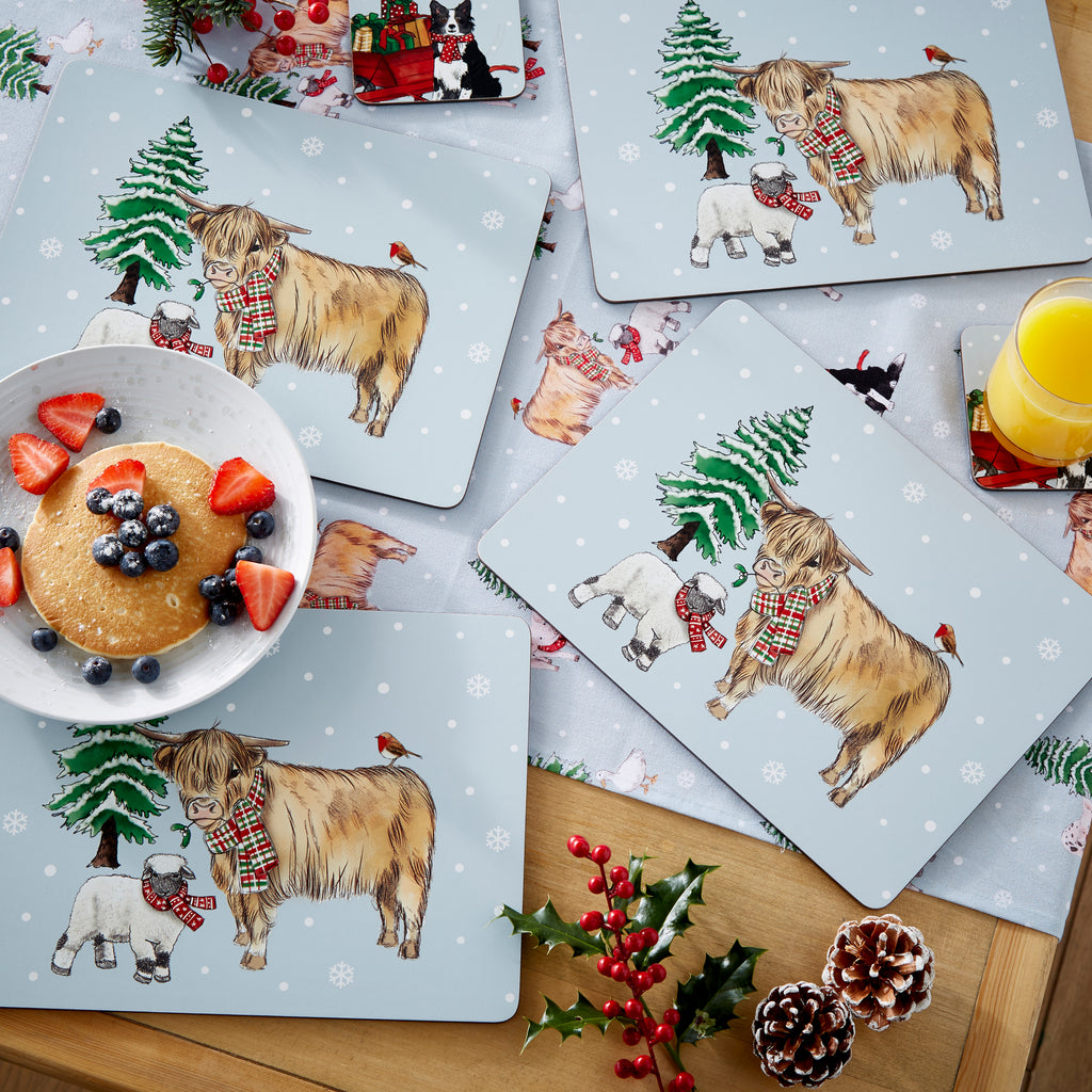 Cooksmart Christmas On The Farm Pack Of 4 Placemats sitting out on a table