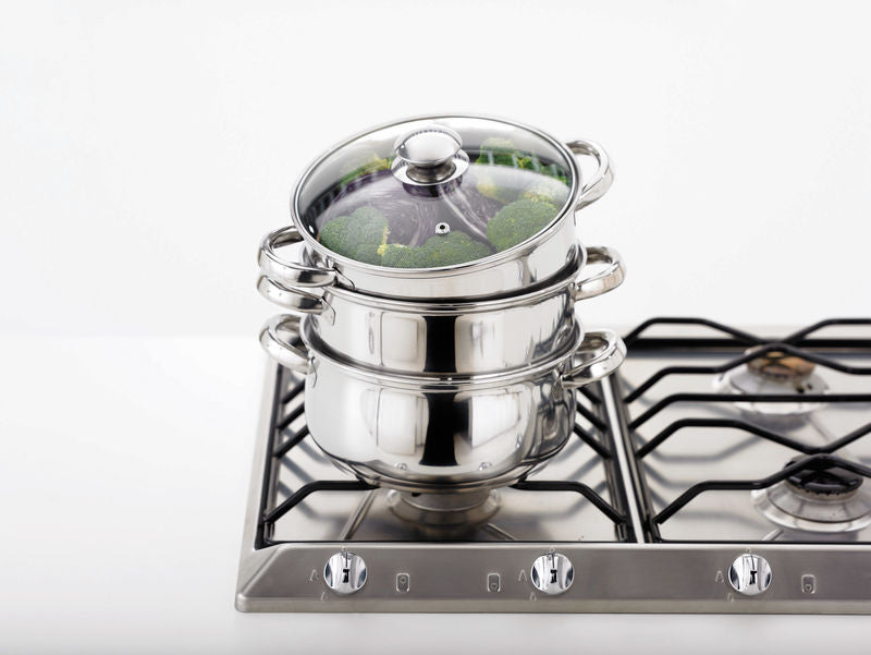 Judge HX04 22cm 3 Tier Steamer sitting on a hob with the lid tilted