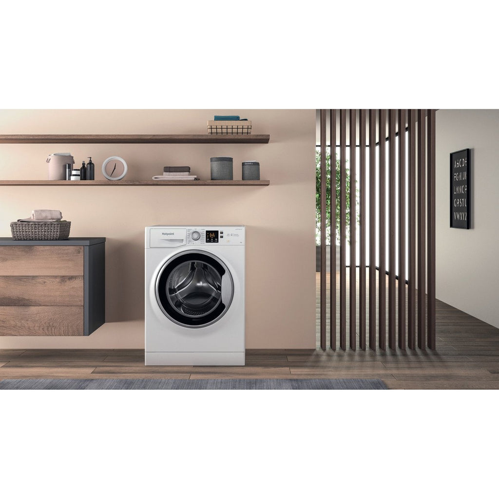 Hotpoint NSWE846WSUK 8kg-1400 Spin Speed Washing Machine - view of the front of the washing machine pictured in a furnished home interior