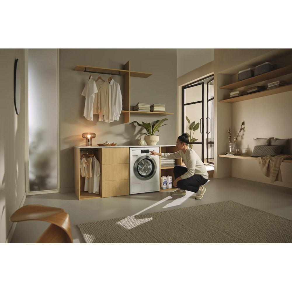 Miele WEG665WCS Twin Dos 9kg Washing Machine - Lotus White - front view of appliance pictured in a home setting