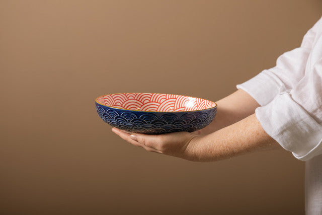 Woman holding Mikasa Blue Arched Pattern Stoneware Bowl