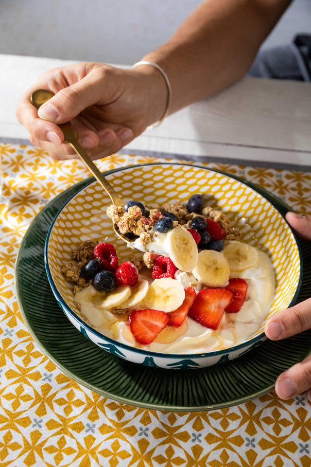 Mikasa Green Leafy Pattern Stoneware Bowl with fruit and granola inside