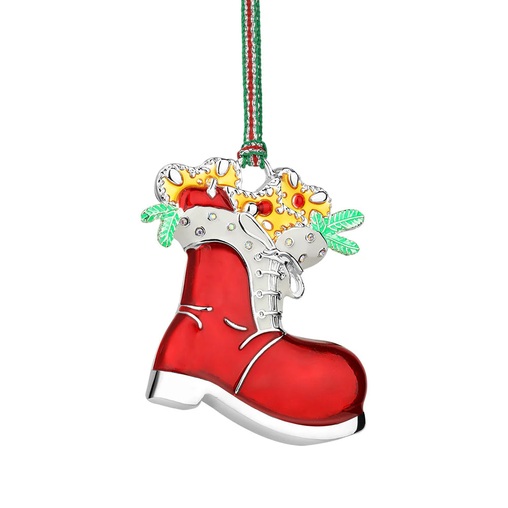 Red boot ornament with gold stars and green leaves on a white background