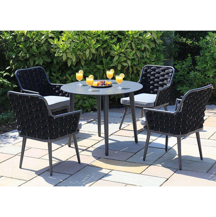 Porto MJT300 4 Seat Garden Set - set placed in a garden location with cold drinks placed on table