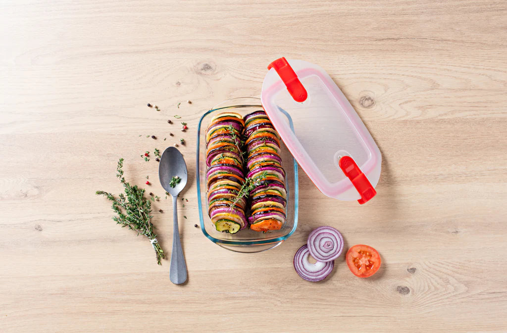 Pyrex Cook & Heat Rectangular 2.6L with veg kebabs in it on a table with herds and a dessert spoon.