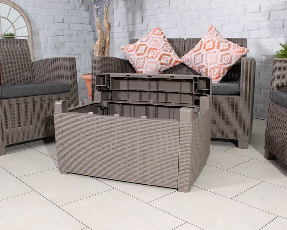 Royalcraft FARO16 4 Seater Conversation Garden Set - furniture set placed in an outdoor environment with close-up of the coffee table storage opened