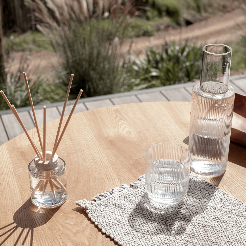 IT04179 Naturals Diffuser 120ML Blood Orange & Pomelo - diffuser pictured on a table outside