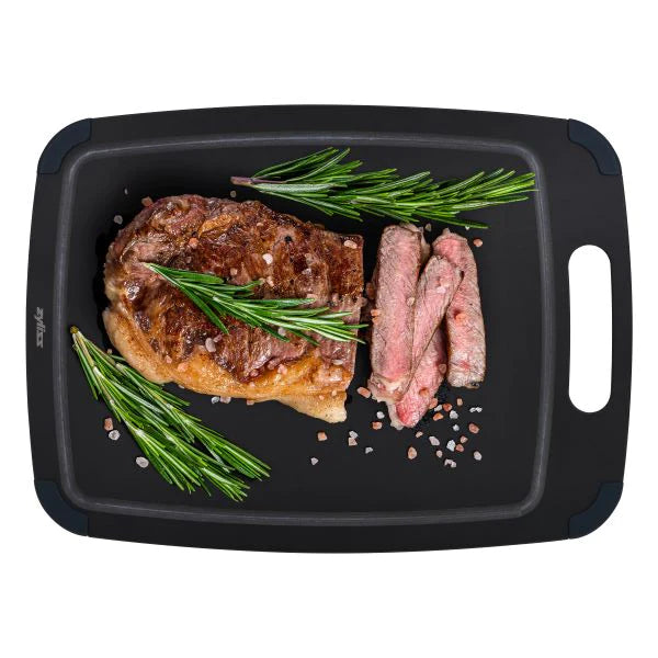Zyliss small fibre chopping board that is being used to serve meat & vegetables on.