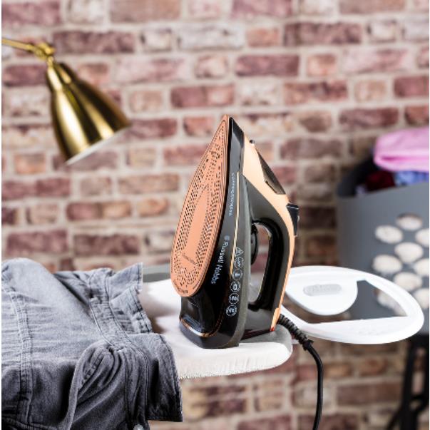 Copper Express Steam Iron on ironing board