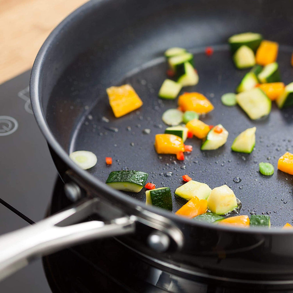 Stellar 7000 Non-Stick Frypan with vegetables on it