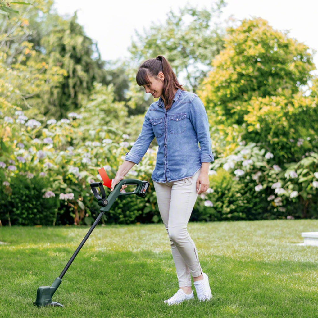 Woman using  Cordless Strimmer