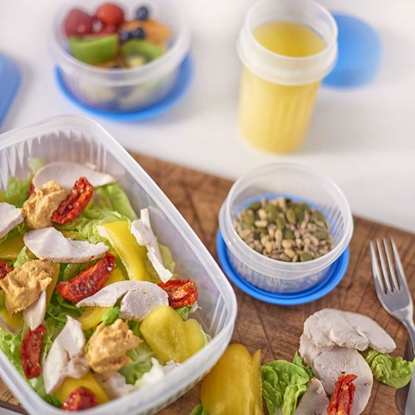 Addis 510450 Foodsaver Rectangular 2L , White sitting on a table with someone's lunch inside the container
