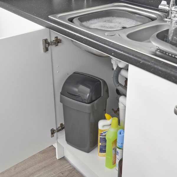 Addis 510504 Roll Top Bin 10L Metallic sitting in a cupboard under the sink