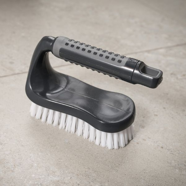 Addis 517700 Comfi Grip Iron Hand Scrub,  Graphite sitting on the floor