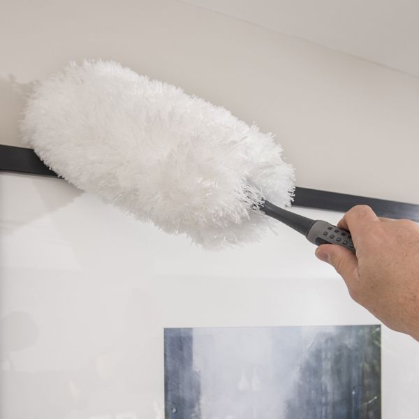 Addis 517705 Comfi Grip Flexible Duster, Graphite showing someone dusting a picture