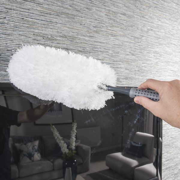 Addis 517705 Comfi Grip Flexible Duster, Graphite showing someone dusting aTV