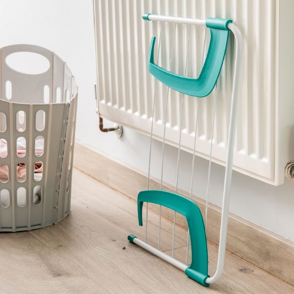 Addis 518042 Radiator Airer 3m flat folded against a radiator