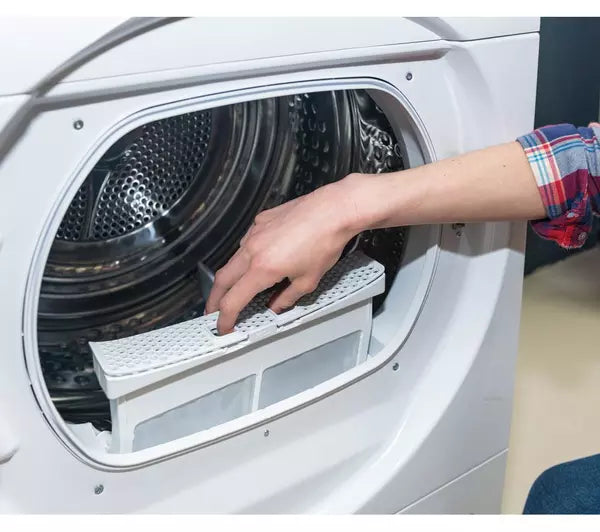 man placing filter inside drum