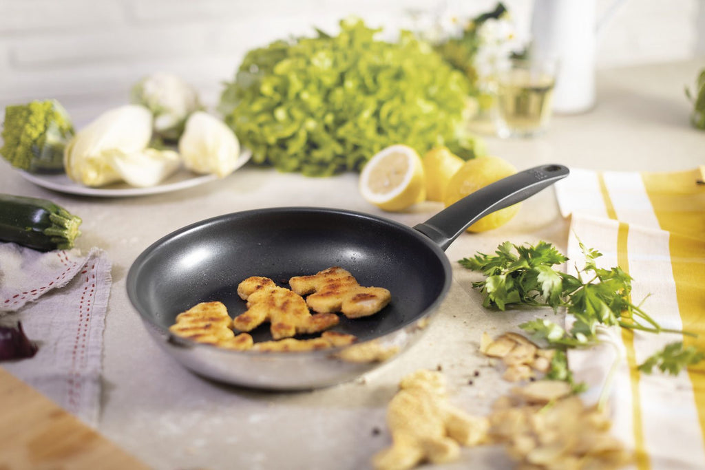 Classic Induction 28cm Non-Stick Frypan 31762 Kuhn Rikon sitting on the kitchen worktop with food inside