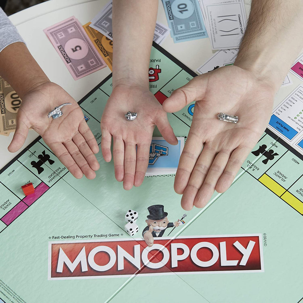 Monopoly Classic Game Hands showing tokens