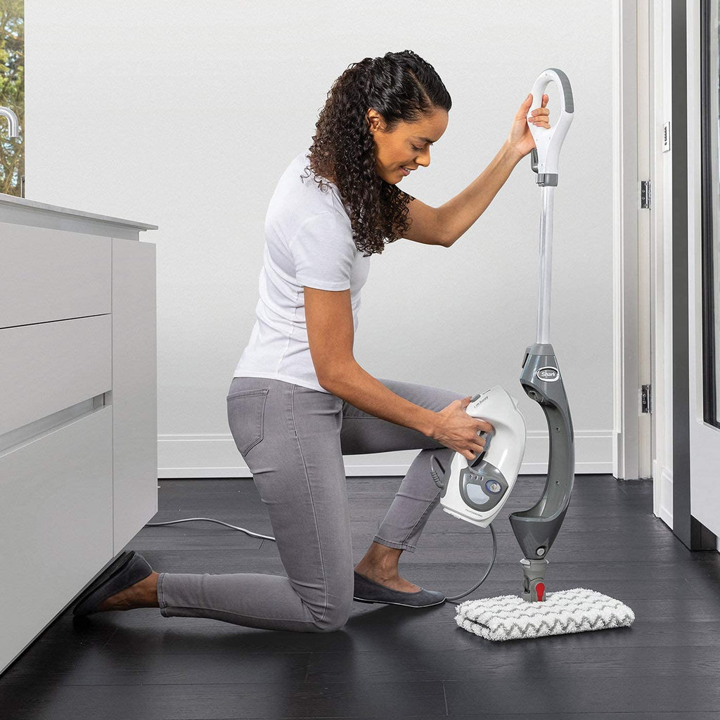 Woman removing Floor and Handheld Steam Cleaner