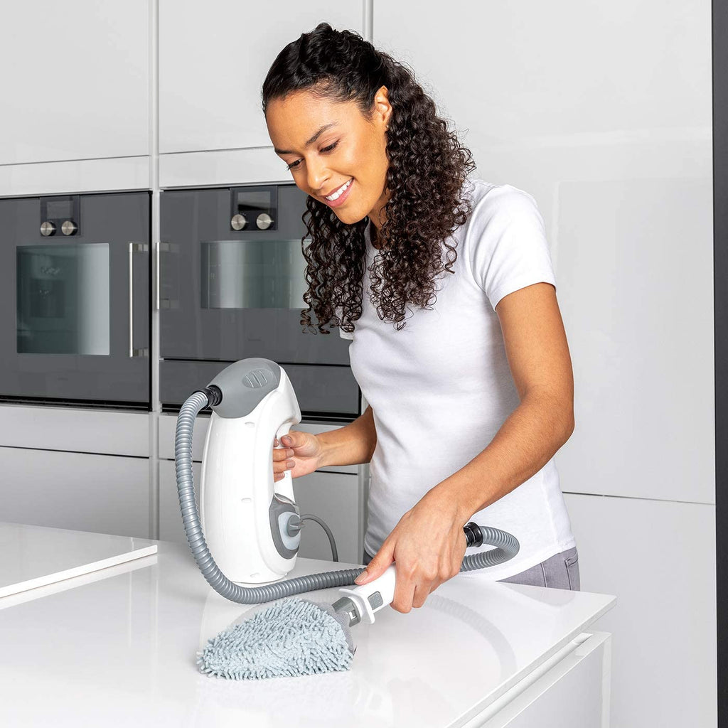 Woman Cleaning Kitchen with Floor and Handheld Steam Cleaner