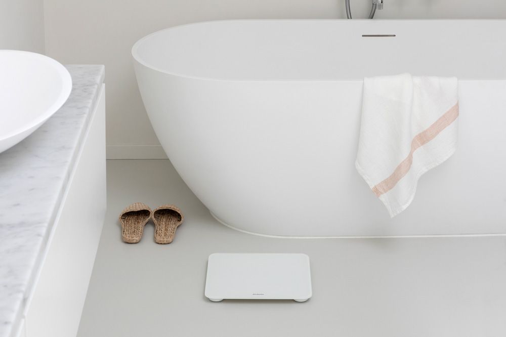 White Digital Bathroom Scales next to bathtub 