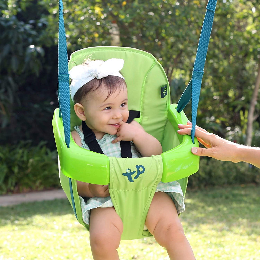 Baby sitting in small swing frame